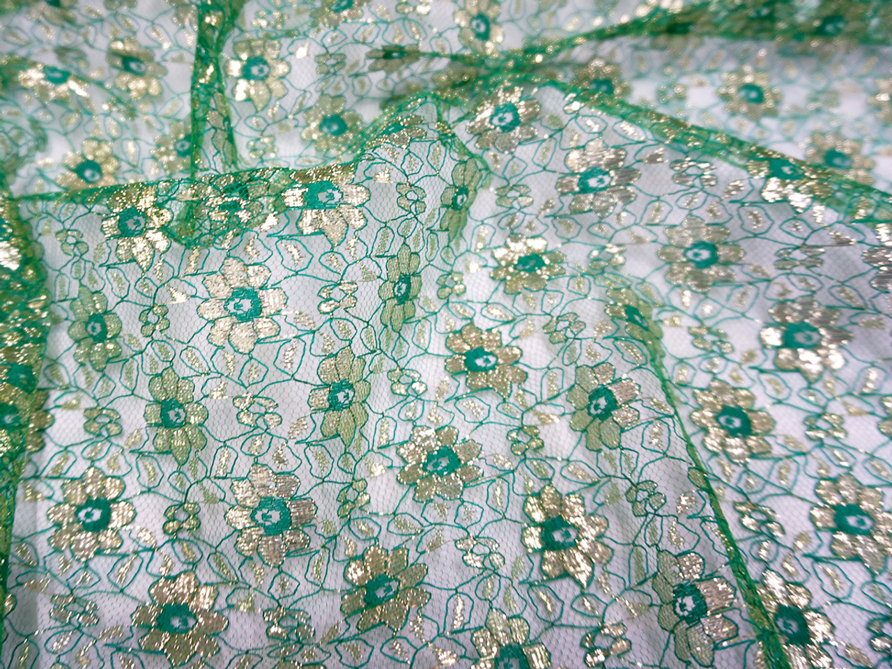 Jasmine Flower Embroidered Net Mesh Fabric Emerald Gold Bangkok Thai Silk It is totally transparent and lightweight, and can be made of various fibers, including silk, nylon, rayon and other synthetic fibers. jasmine flower embroidered net mesh fabric emerald gold