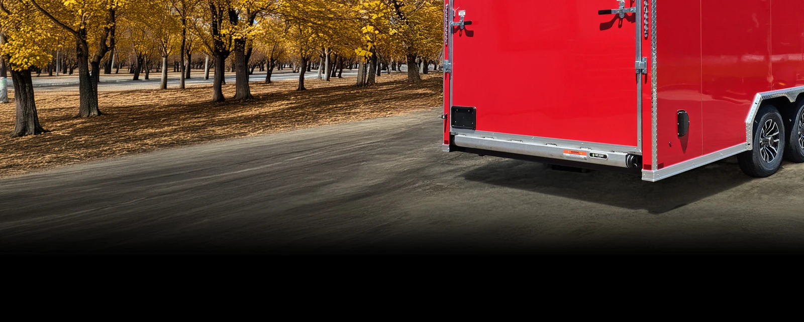 Safe Assist installed on a red trailer in front of a fall background.