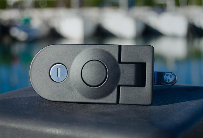 Close up of compression latch with marina in background