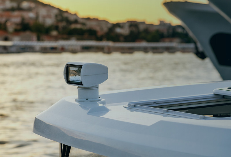 Spotlight on side of boat on the water
