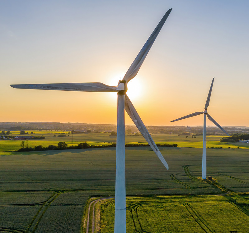 Wind turbines in field