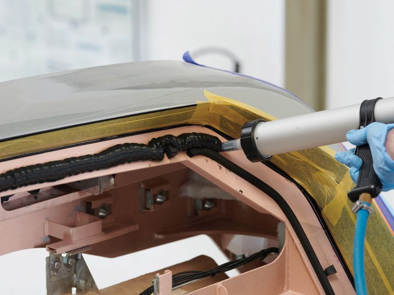 A zoomed in view of SABA's Sabatack 780 being applied by gun to a vehicle frame.