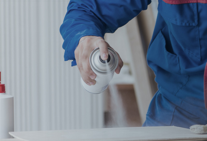 Spraying Chemical from Spraycan