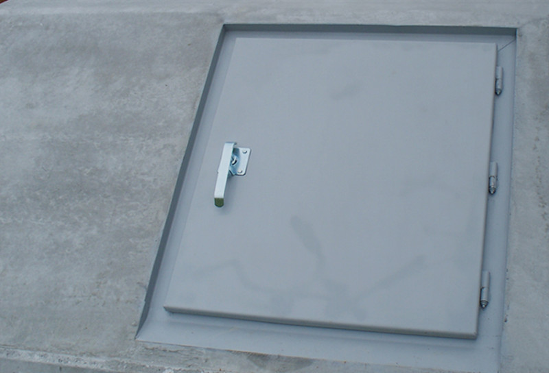 Storm shelter door showing handle to entrance door
