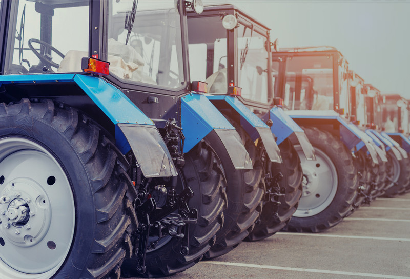 Row of tractors parked on lot