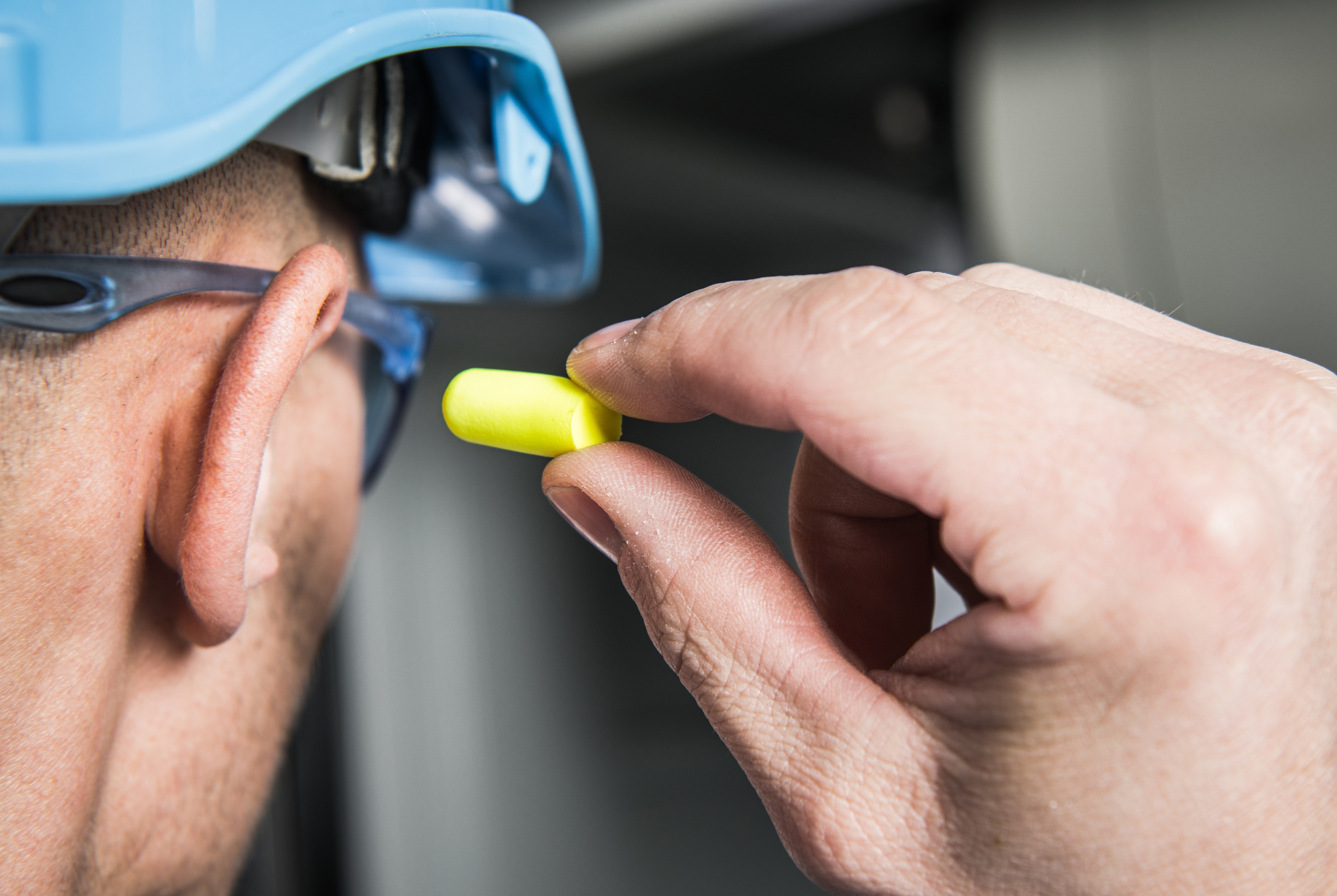 Person putting ear plugs in