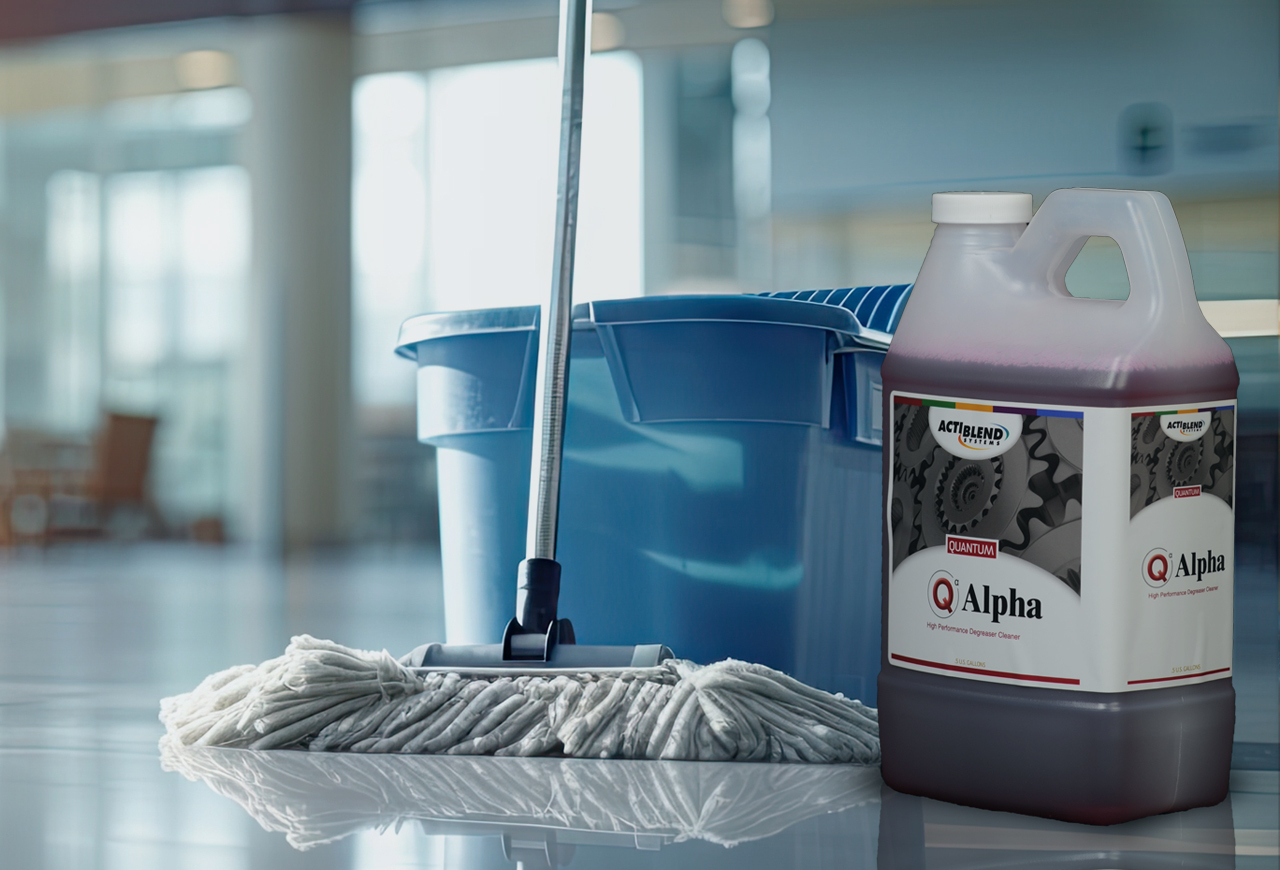 Mop and bucket in commercial setting with bottle of Alpha cleaner