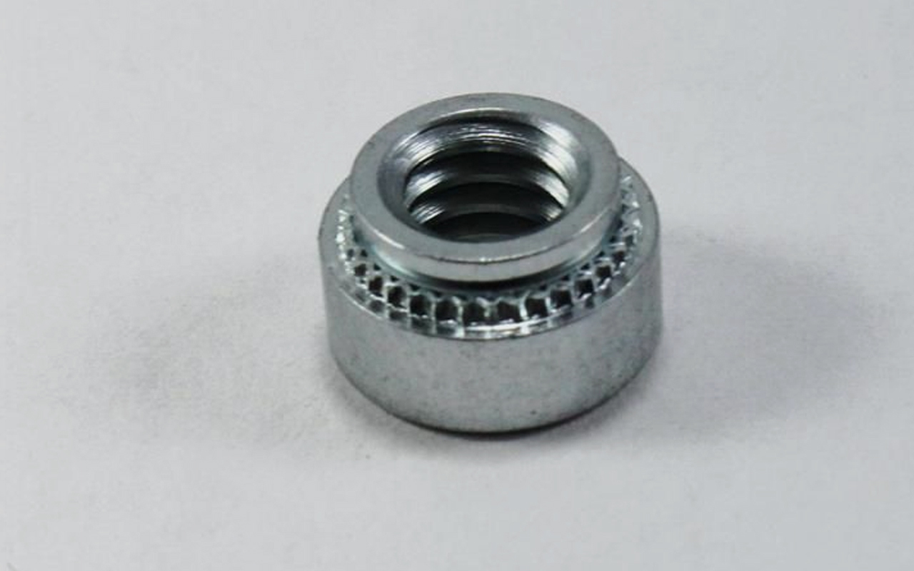 Self-clinching nut on white background