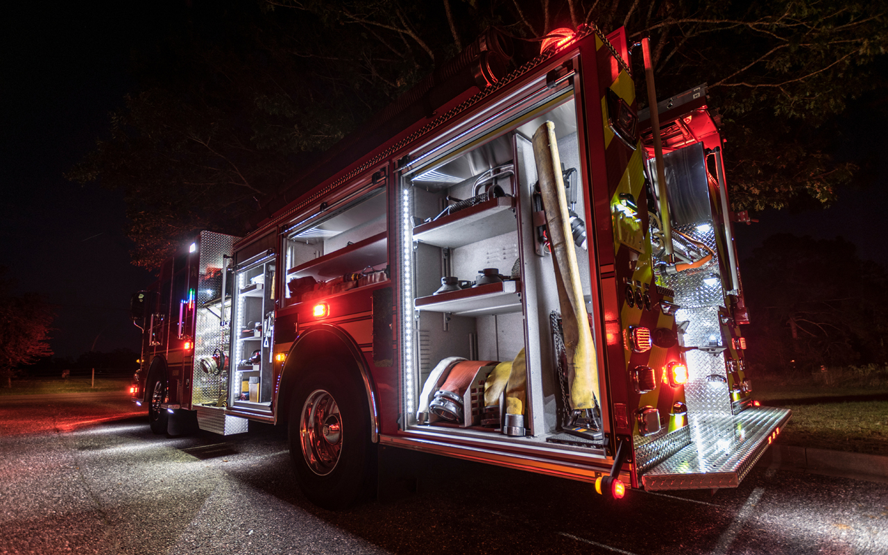 Firetruck with lights on at night