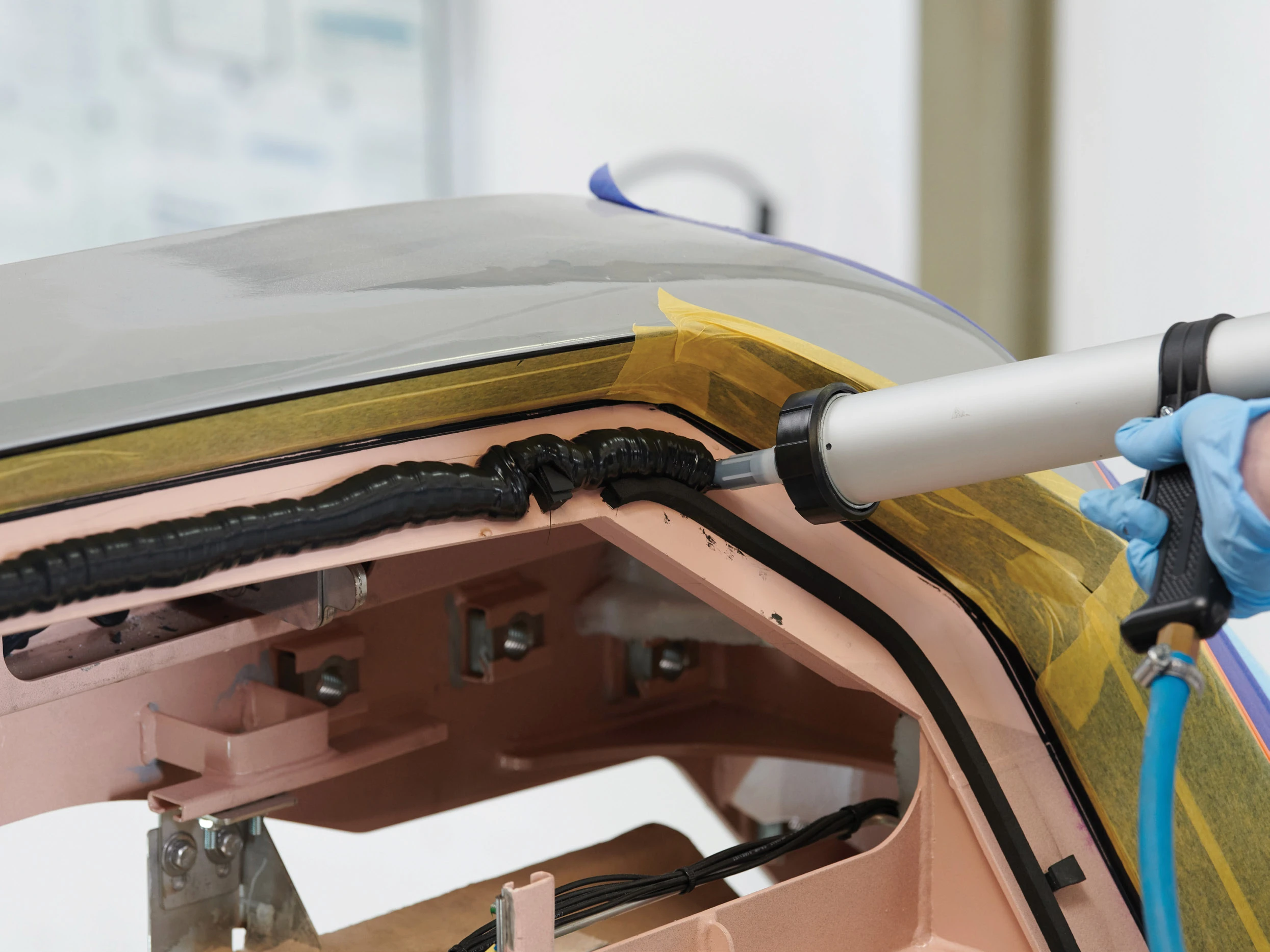 SABA adhesive being applied to a vehicle frame