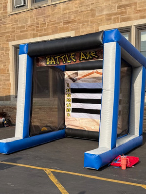 This Axe Throw game is inflatable and completely safe, no sharp edges here! The axes are made of foam and have velcro edges that stick to the target. Two people or teams compete against each other to try and score the most points.