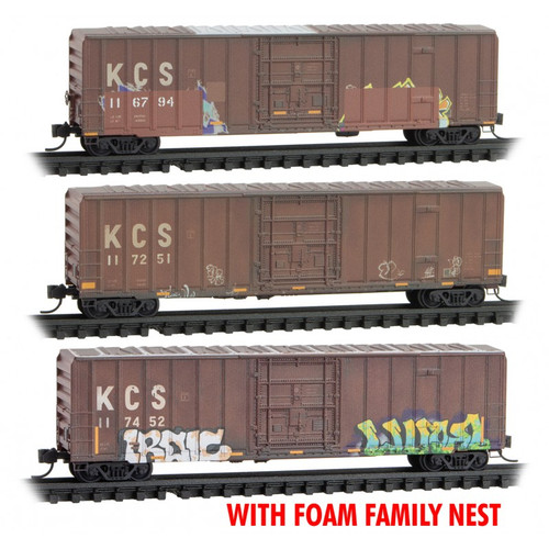 Micro-Trains 50' Rib-Side Plug-Door Boxcar No Roofwalk 3-Pack in Foam Nest - Ready to Run -- Kansas City Southern #117694, 117251, 117452 (Weathered, brown, Graffiti) - 489-99305018