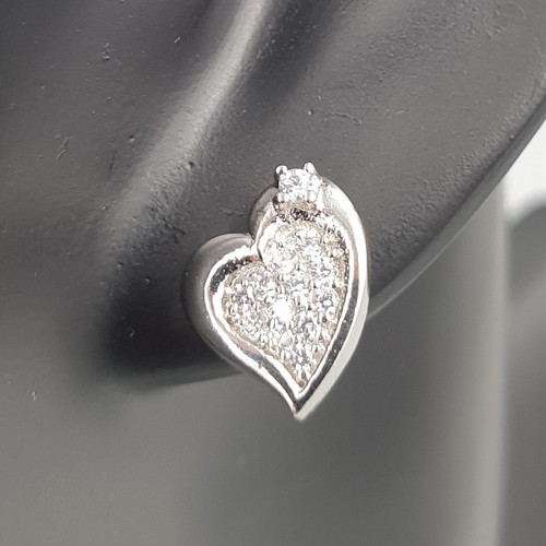 Shimmering Hearts Cubic Zirconia Stud Earrings in Silver Finish on ear close up