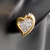 Shimmering Hearts Cubic Zirconia Stud Earrings in Dual Finish on ear