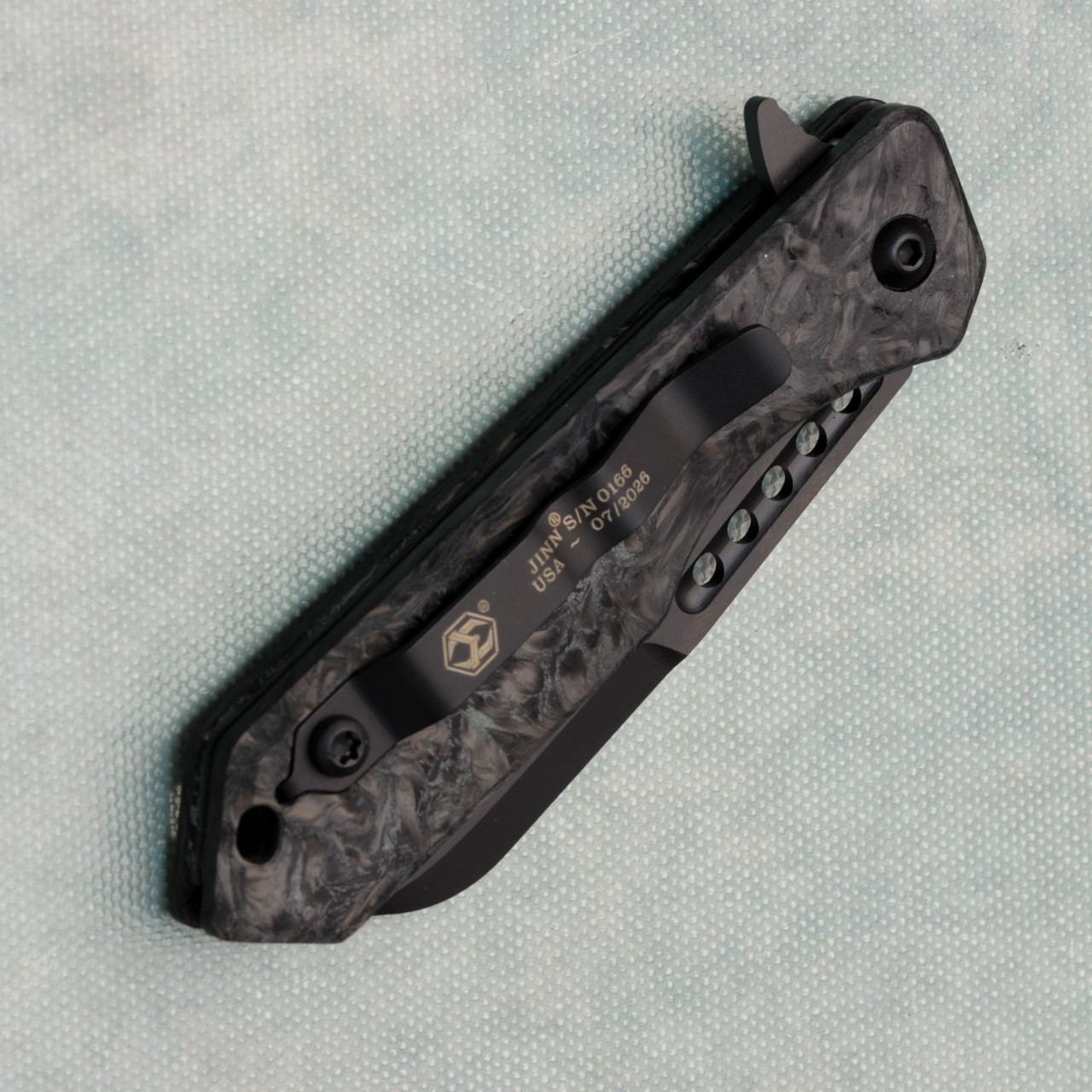 Heretic Knives Jinn Manual Button Lock Marble Glow Carbon Fiber