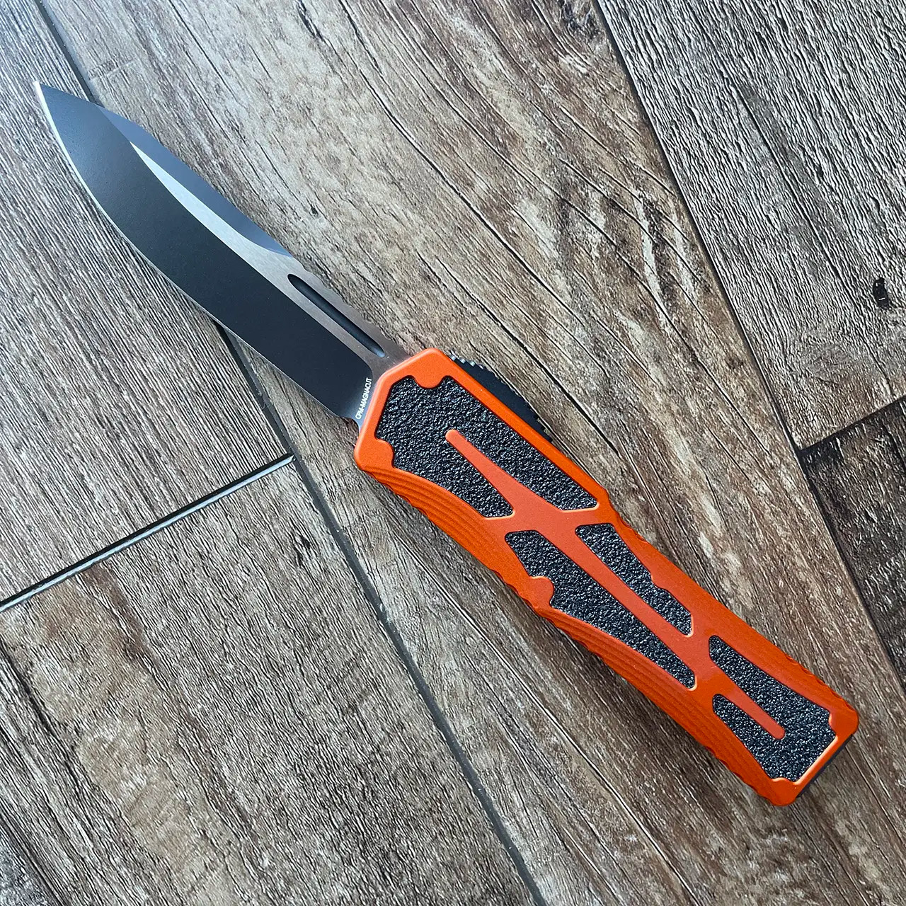 Heretic Knives Colossus S/E Orange Handle w/ Black Grip Inlays Two