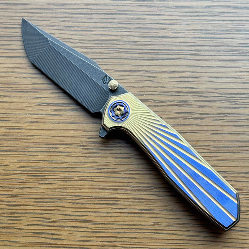 NCC Knives Ragnarok V7 Frame Lock Gold/Purple Solar Flare Titanium Handles Acidwash Harpoon Blade