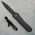 Heretic Knives Manticore X D/E Black Mortal Combat Scorpion Handle w/ Gold Fat Carbon Back DLC Standard Blade H032-6A-SCOR (Pre-owned)