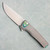MachineWise Sonora Button Lock Flipper Streamline Texture Titanium Integral Handle Chameleon Titanium Bolster Stonewash S90V Blade
