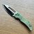 Heretic Knives Koschei Custom Crossbar Lock Antique Green Titanium Handle Bronze Cracked Ice M390 Blade Abalone Button Inlay