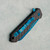 Heretic Knives Jinn Manual Button Lock Carbon Fiber Handle Metallic Teal Magnacut Blade H213-MT-CF