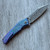 G&G Hawk X John Gray Collab Talon Hawk Lock w/Toggle Detent Purple/Blue Titanium Handle w/ Hammered Blue/Purple Titanium Inlays Acid Rain Blade Clip Side