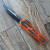 Heretic Knives Colossus S/E Orange Handle w/ Black Grip Inlays Two Tone Black Blade H039-10A-ORG