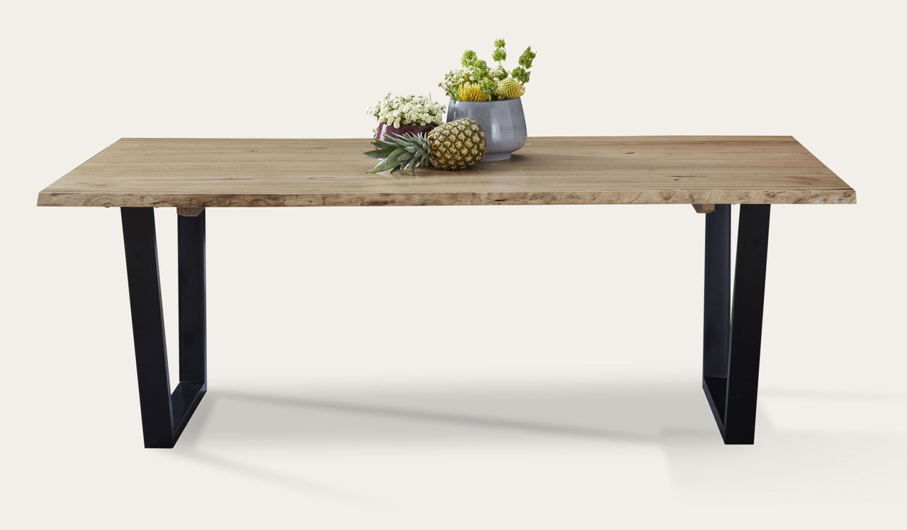 Archie dining table in solid messmate timber with live edge detail and black metal legs, modern timber dining table