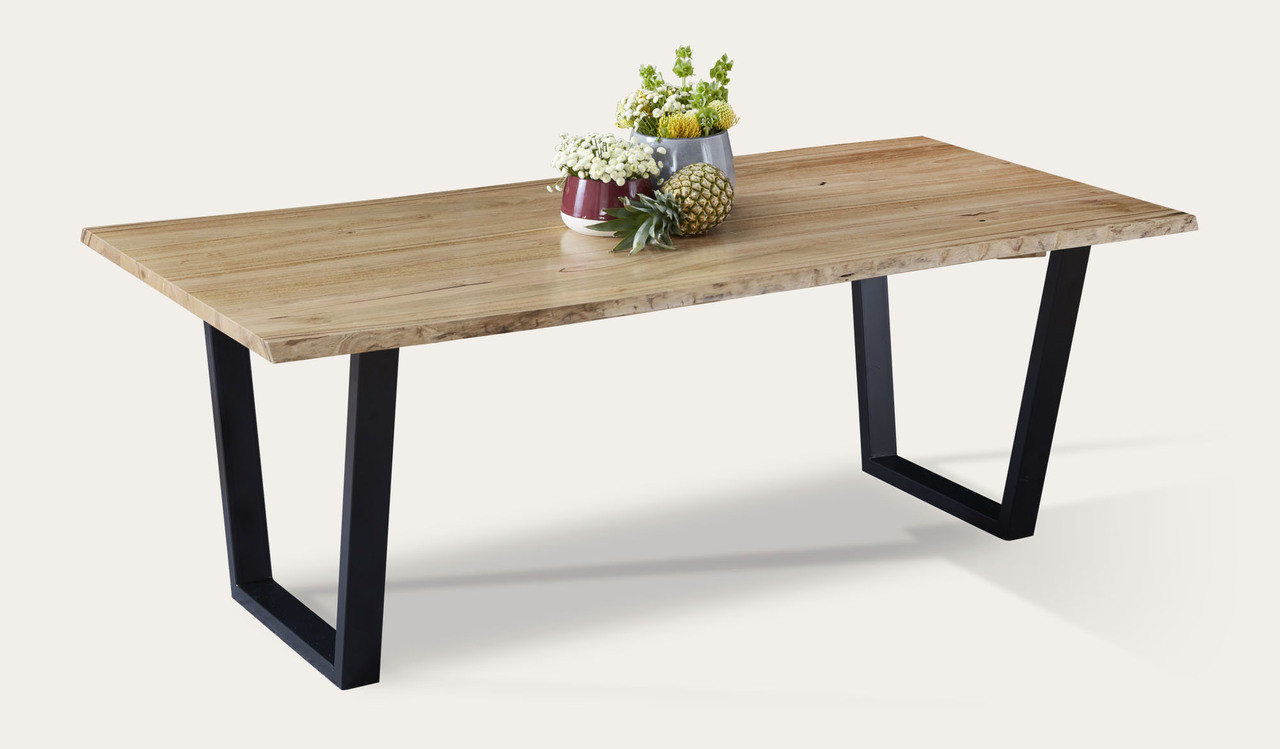 Archie dining table in solid messmate timber with live edge detail and black metal legs, modern timber dining table