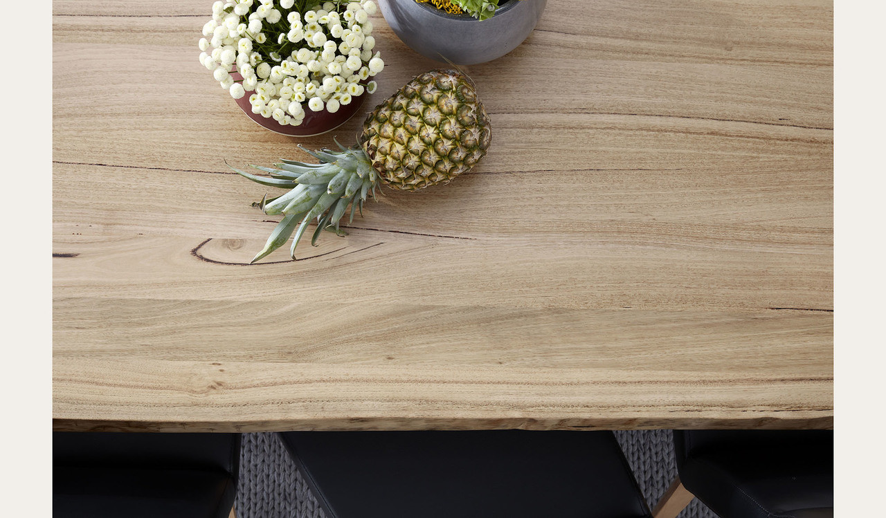 Archie dining table in solid messmate timber with live edge detail and black metal legs, modern timber dining table