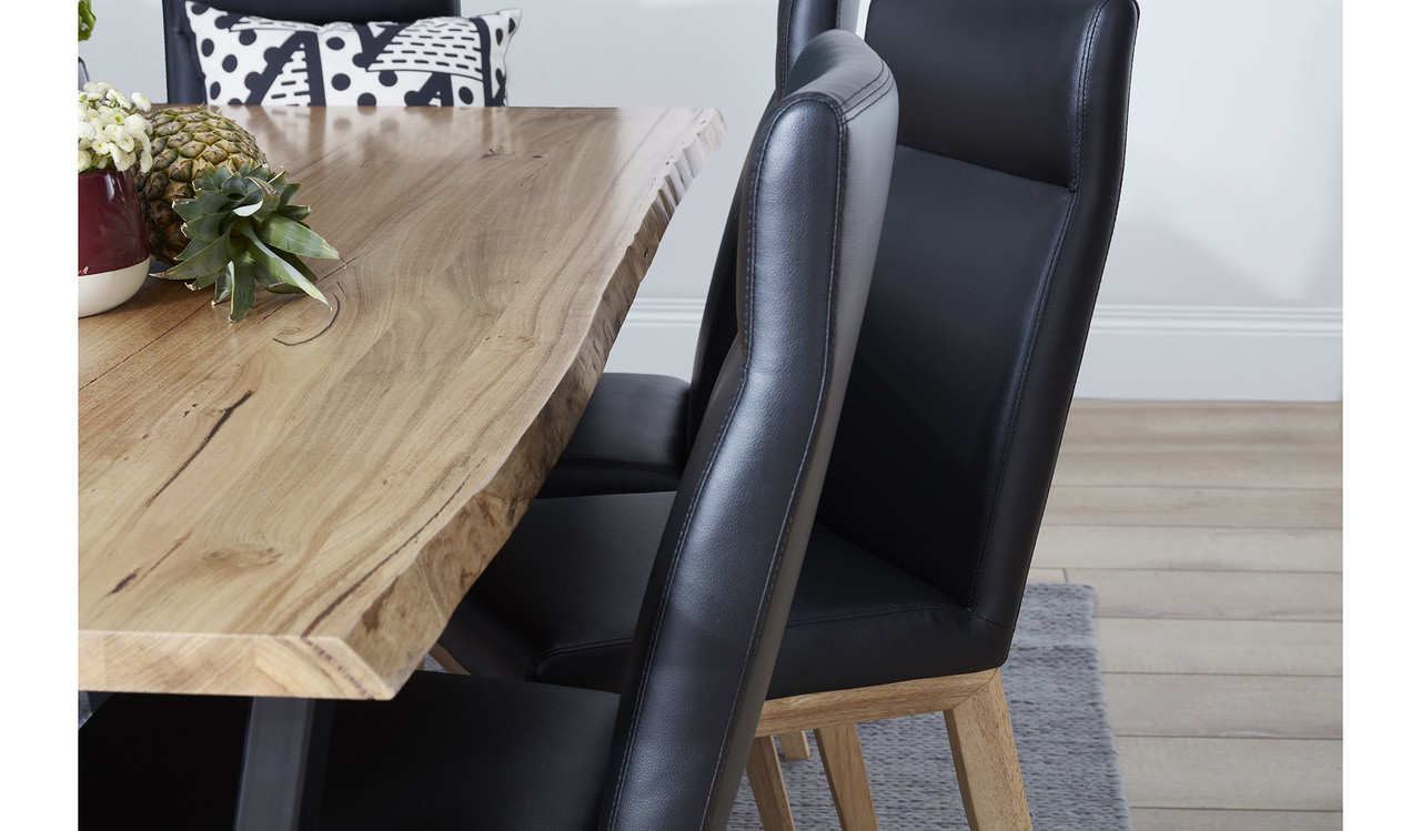 Archie dining table in solid messmate timber with live edge detail and black metal legs, modern timber dining table
