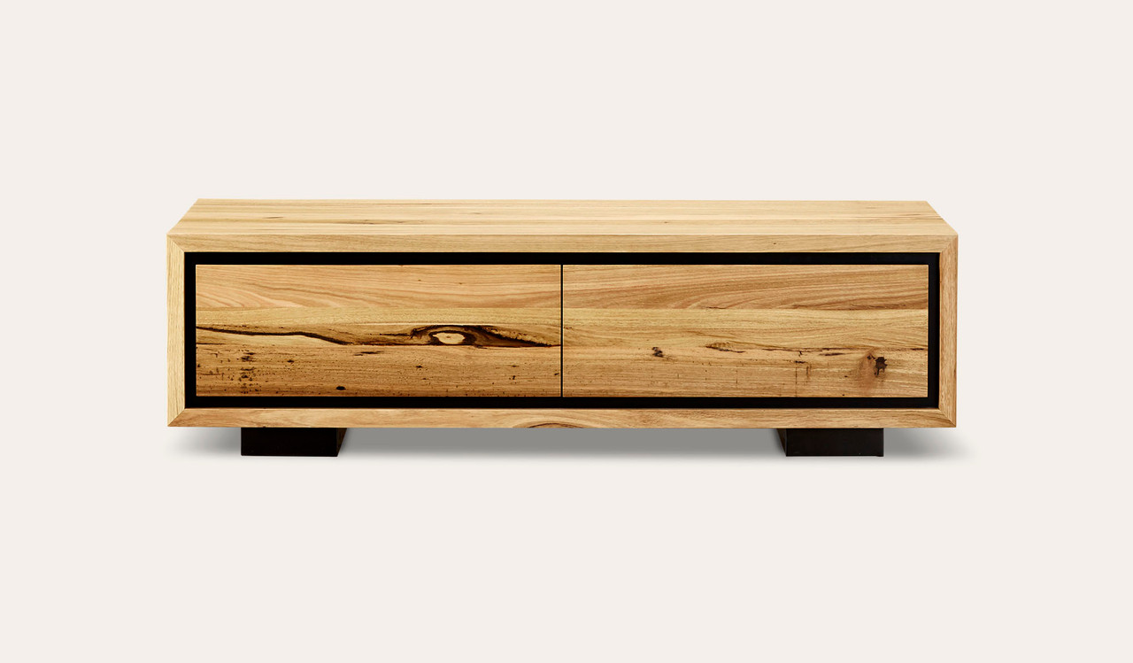 Eden coffee table in sustainable Australian messmate timber with unique knots, sleek modern edges, and black detailing
