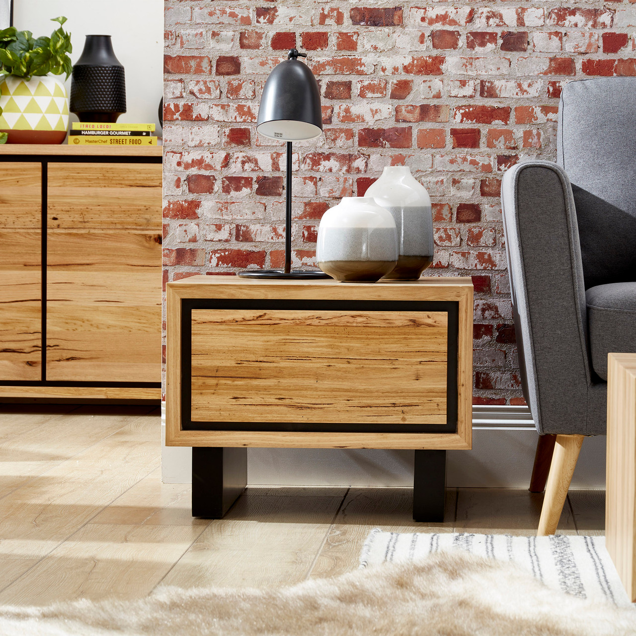 Eden lamp table in sustainable Australian messmate timber with sleek modern edges and black detailing, contemporary timber side table