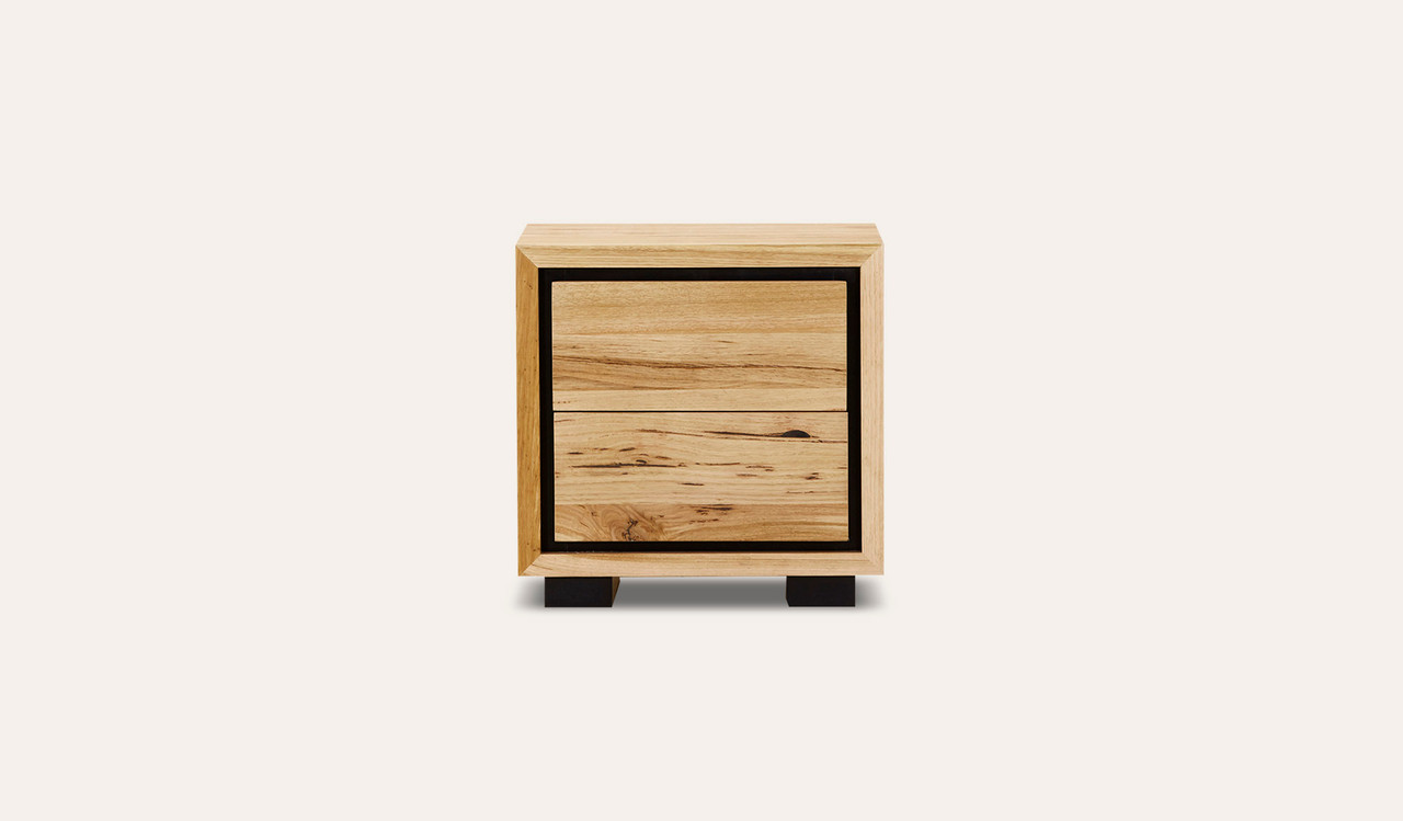 Eden bedside table in sustainable Australian messmate timber with sleek modern edges and black detailing, contemporary timber bedside table