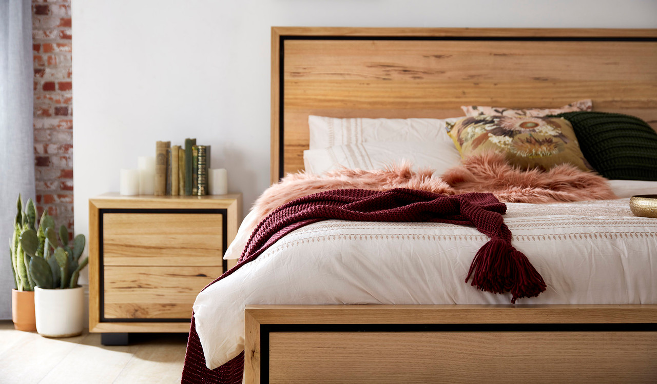 Eden bedside table in sustainable Australian messmate timber with sleek modern edges and black detailing, contemporary timber bedside table