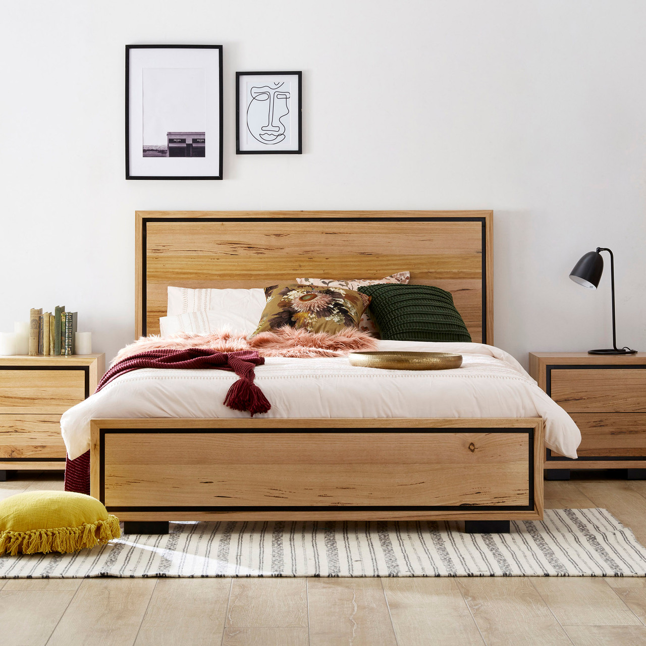 Eden bed in sustainable Australian messmate timber with natural knots, sleek edges, and black detailing, modern timber bed frame