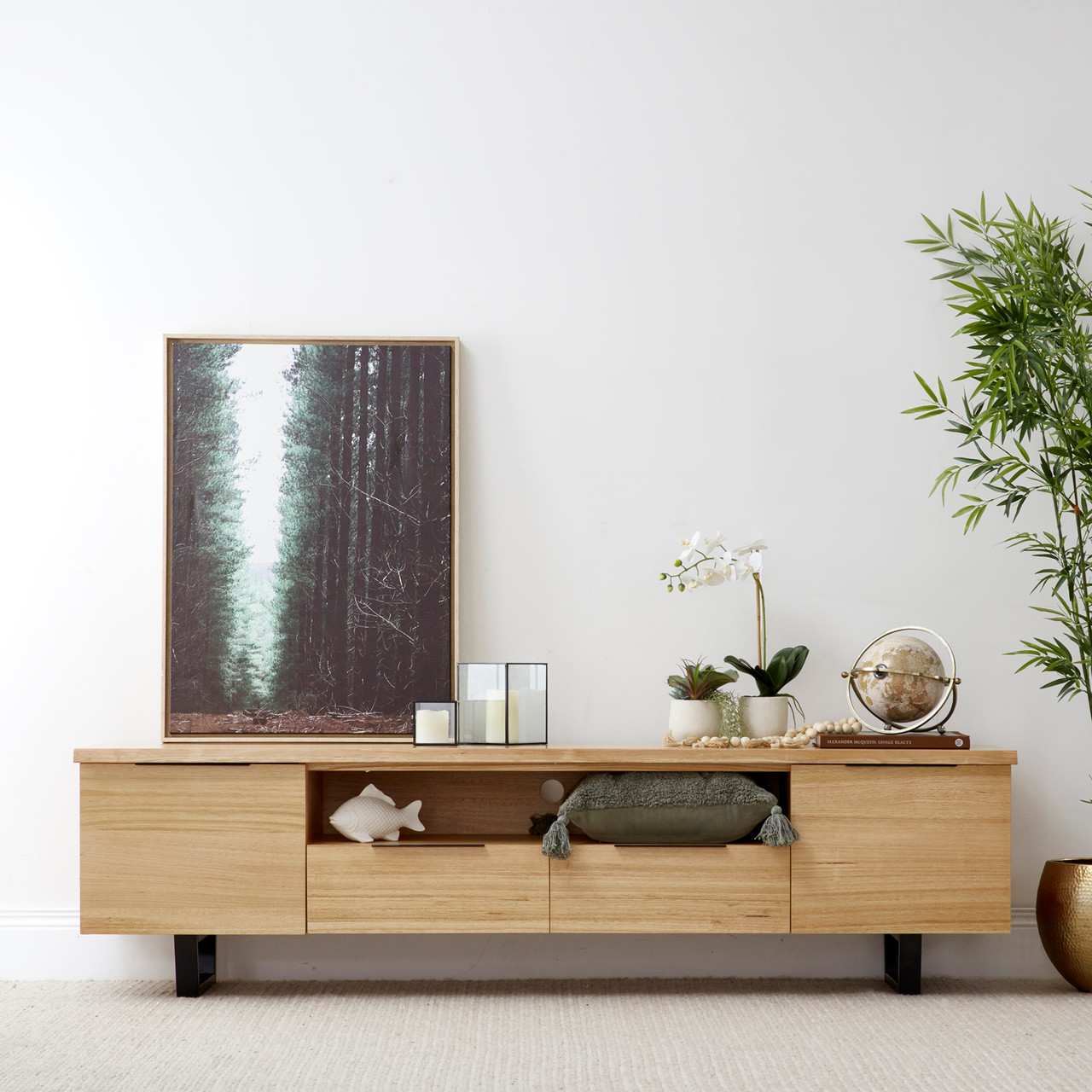 Braxton entertainment unit in solid messmate timber with black metal legs and multiple storage compartments
