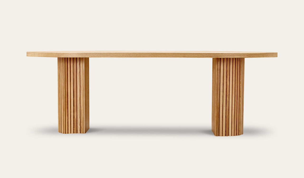 Eclipse natural ash dining table with distinct sculptural base and modern design, creating a sophisticated and timeless statement for the dining room