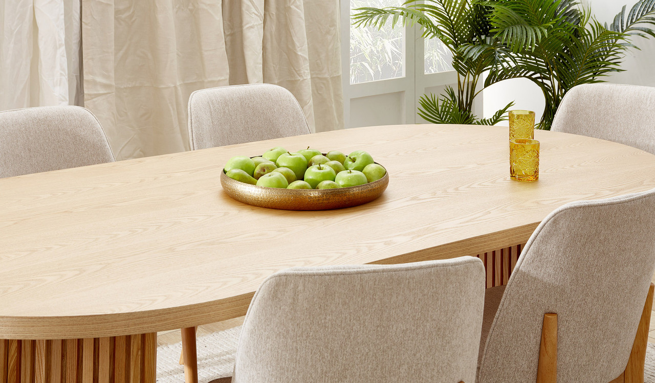 Eclipse natural ash dining table with distinct sculptural base and modern design, creating a sophisticated and timeless statement for the dining room