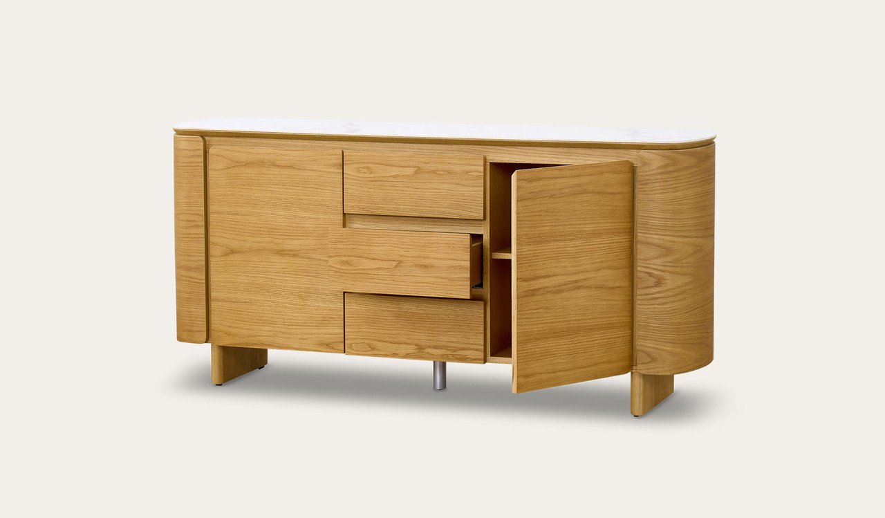 Cara buffet with matte white carrara-look ceramic top, natural oak finish, three soft-close drawers and two doors with internal shelf, 1600mm wide
