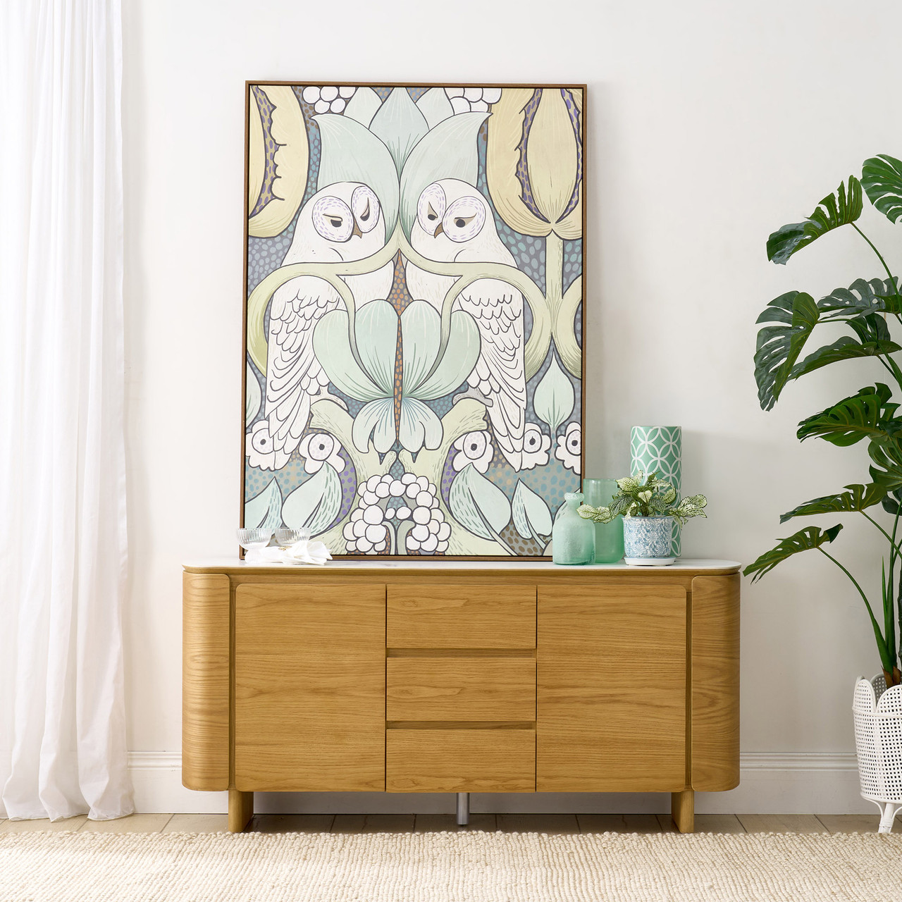 Cara buffet with matte white carrara-look ceramic top, natural oak finish, three soft-close drawers and two doors with internal shelf, 1600mm wide