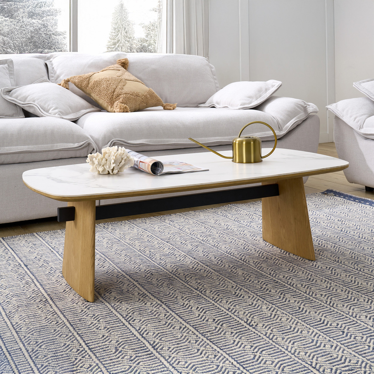 Cara coffee table with matte white carrara-look ceramic top and natural oak finish, contemporary round coffee table