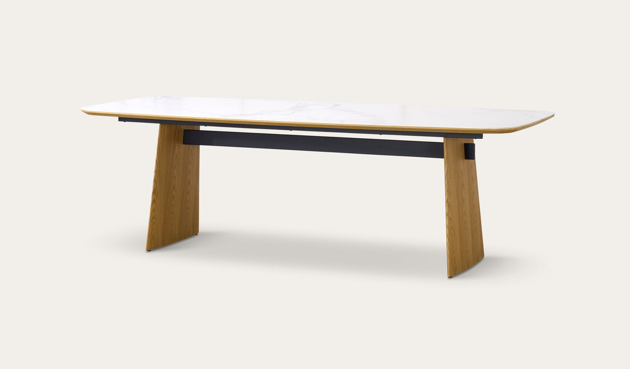 Cara dining table with matte white carrara-look ceramic top and natural oak finish, modern rectangular dining table