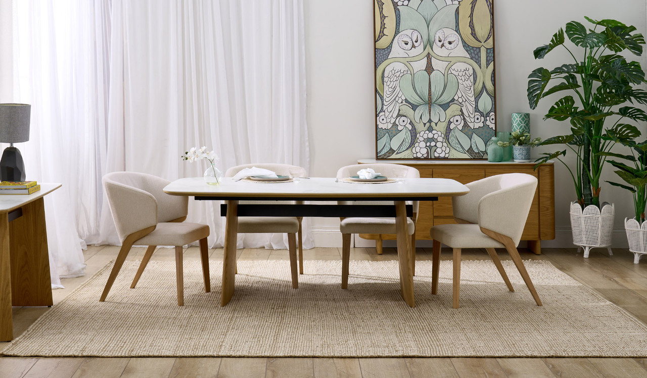 Cara dining table with matte white carrara-look ceramic top and natural oak finish, modern rectangular dining table