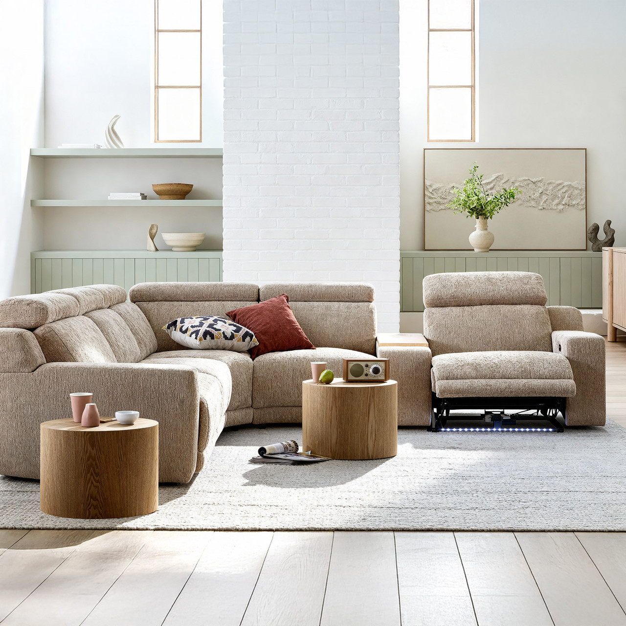 Clayton recliner corner lounge in a neutral fabric, featuring a spacious L-shape design with electric reclining seats.