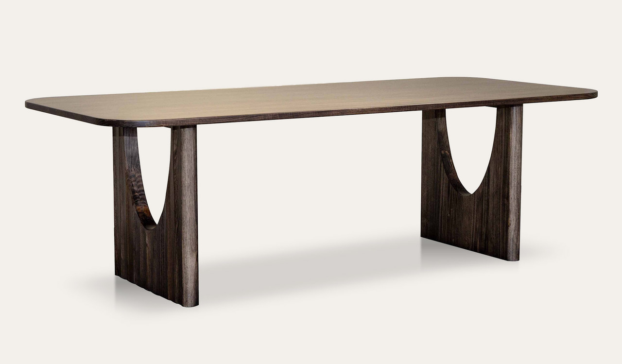 Alira ash timber dining table with a strong, organic silhouette, made from solid ash timber and ash veneer for a timeless dining space.