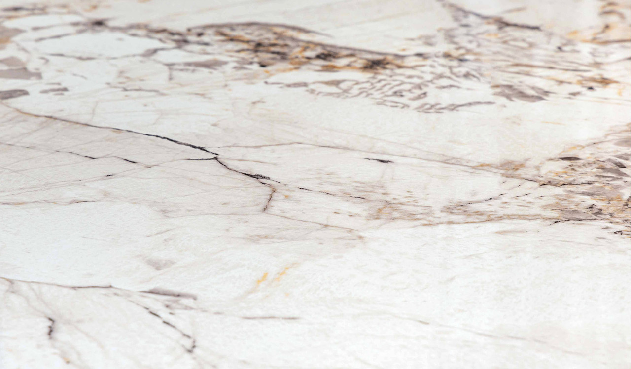 Montera dining table featuring a glossy marble-look sintered stone top with warm umber timber base, creating a bold and refined centrepiece for modern dining spaces.