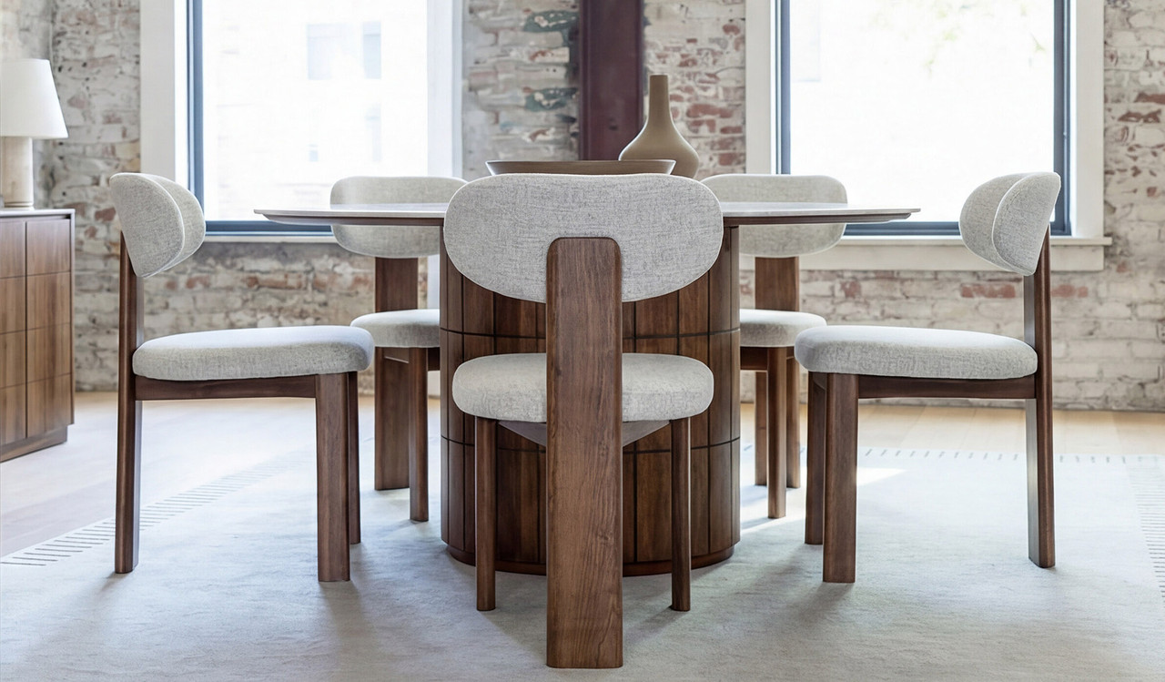 Montera round dining table featuring a glossy marble-look sintered stone top with warm umber timber base, creating a bold and refined centrepiece for modern dining spaces.