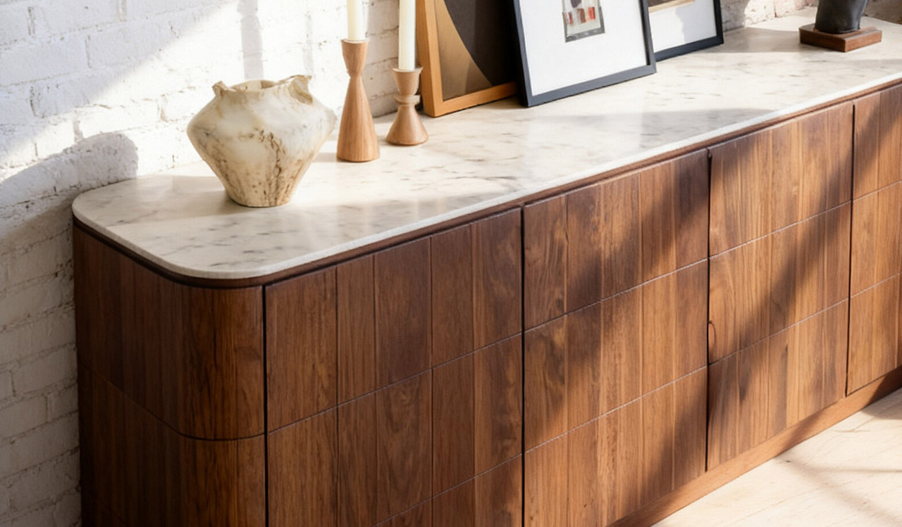 Montera buffet with a glossy marble-look sintered stone top and umber timber cabinetry, combining statement design with practical dining storage.