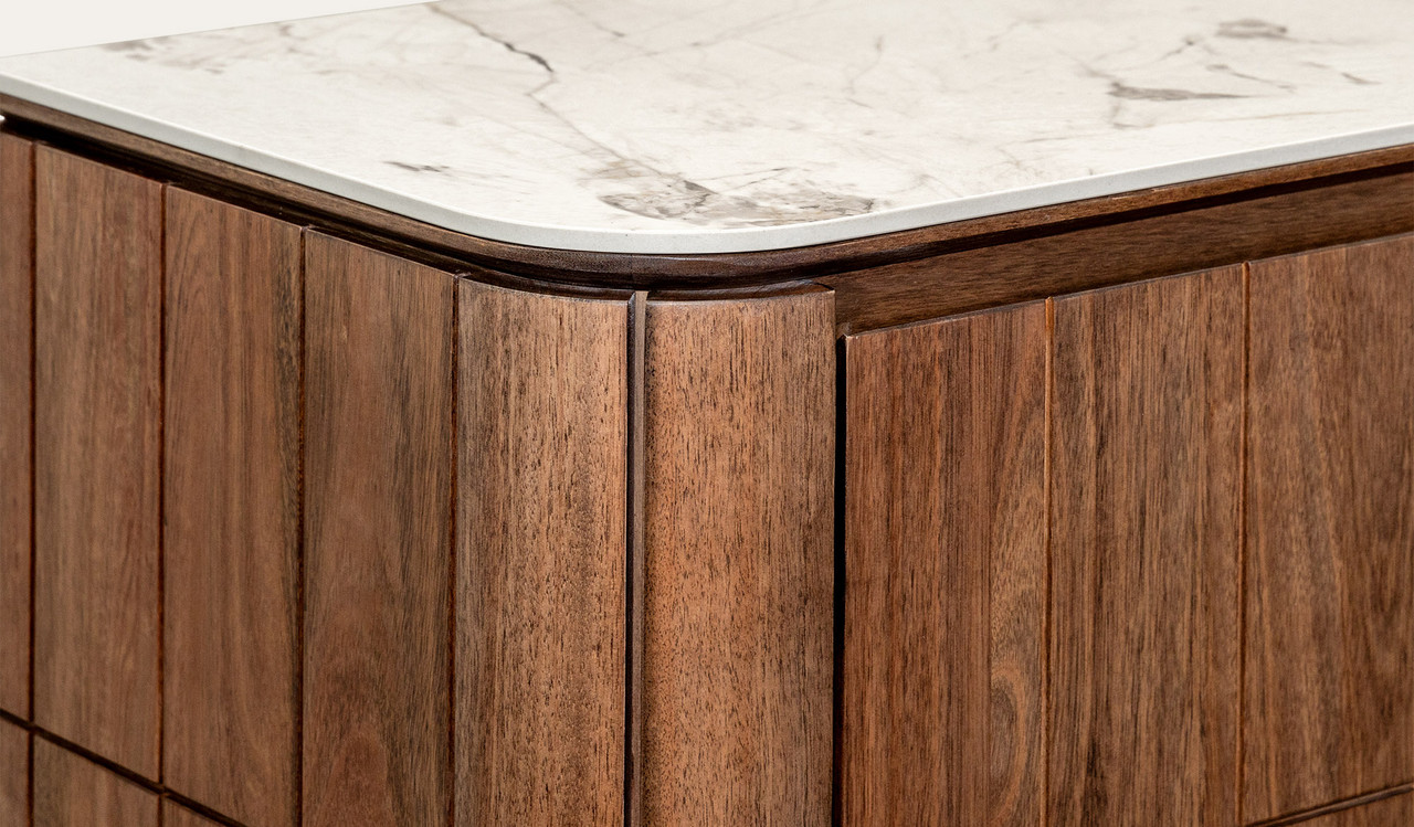 Montera buffet with a glossy marble-look sintered stone top and umber timber cabinetry, combining statement design with practical dining storage.